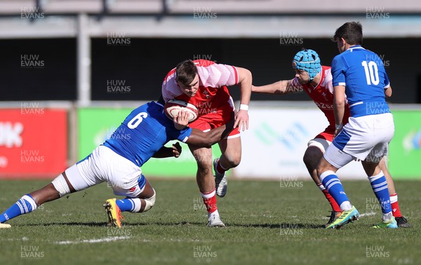 200322 - Wales U20s v Italy U20s - U20s 6 Nations Championship - Cameron Jones of Wales is tackled by Davis Odiase of Italy