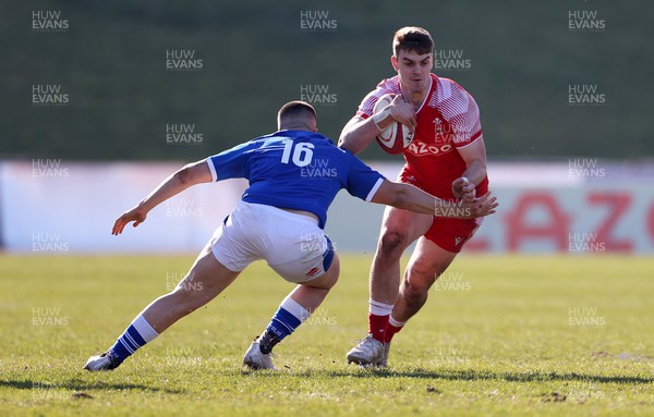 200322 - Wales U20s v Italy U20s - U20s 6 Nations Championship - Bryn Bradley of Wales is tackled by Tommaso Scramoncin of Italy