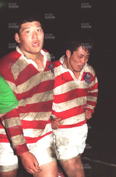 150395 - Wales v Japan Rugby - Disappointed Japanese players leave the field after their defeat 