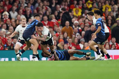 151125 - Wales v Japan - Quilter Nations Series - Louis Rees-Zammit of Wales is tackled by Dylan Riley and Charlie Lawrence of Japan  