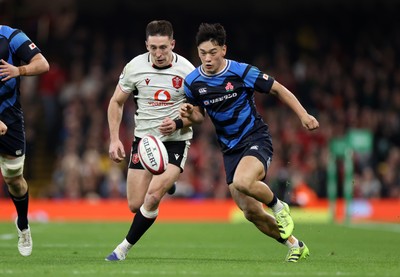 151125 - Wales v Japan - Quilter Nations Series - Josh Adams of Wales is challenged by Seungsin Lee of Japan 