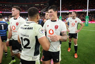 151125 - Wales v Japan - Quilter Nations Series - Ben Thomas and Louis Rees-Zammit of Wales celebrate at full time