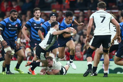 151125 - Wales v Japan - Quilter Nations Series - Tomoki Osada of Japan is tackled by Tomos Williams of Wales