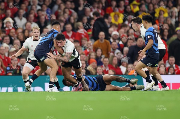151125 - Wales v Japan - Quilter Nations Series - Louis Rees-Zammit of Wales is tackled by Dylan Riley and Charlie Lawrence of Japan  