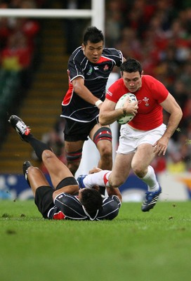 20.09.07 Wales v Japan RWC2007 Wales'  Stephen Jones is tackled by Japan's Hare Makiri  