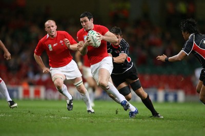 20.09.07 Wales v Japan RWC2007 Wales'  Stephen Jones goes past Japan's Luke Thompson 