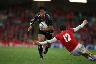 20.09.07 Wales v Japan RWC2007 Wales'  James Hook tries to stop Japan's Kosuke Endo 