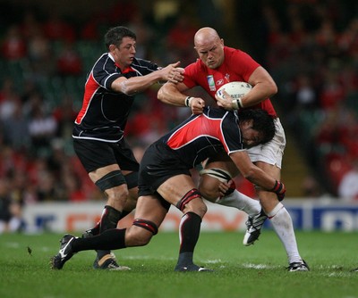 20.09.07 Wales v Japan RWC2007 Wales' Will James powers through Japan's Hitoshi Ono and Luke Thompson 