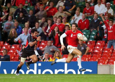 20.09.07 - Wales v Japan RWC 2007 Wales' James Hook beats Japan's Yuta Imamura to claim a try 