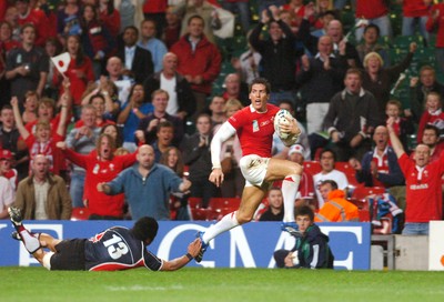 20.09.07 - Wales v Japan RWC 2007 Wales' James Hook beats Japan's Yuta Imamura to claim a try 