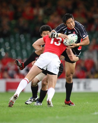 20.09.07 - Wales v Japan, RWC 2007 -   Japan's Kosuke Endo is tackled by Wales' Jamie Robinson 