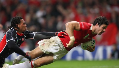 20.09.07 - Wales v Japan, RWC 2007 -  Wales' Michael Phillips beats Japan's Christian Loamanu to score try 