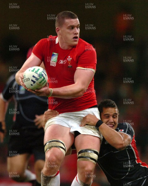 20.09.07 - Wales v Japan - Rugby World Cup 2007 - Wales' Ian Evans is tackled by Bryce Robins 