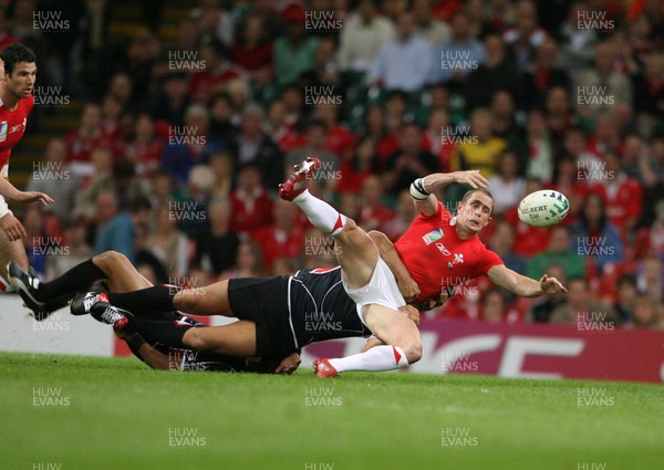20.09.07 Wales v Japan RWC2007 Wales' Shane Williams is tackled by Japan's Shotaro Onishi  