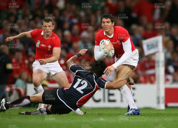 20.09.07 Wales v Japan RWC2007 Wales' James Hook is tackled by Japan's Shotaro Onishi  