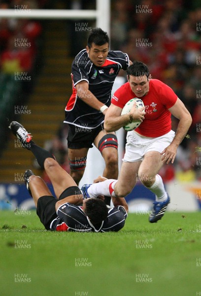 20.09.07 Wales v Japan RWC2007 Wales'  Stephen Jones is tackled by Japan's Hare Makiri  