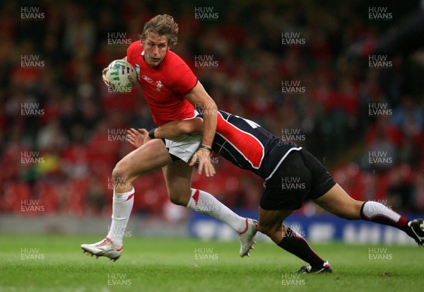 20.09.07 Wales v Japan RWC2007 Wales'  Jamie Robinson is tackled by Japan's Bryce Robins  