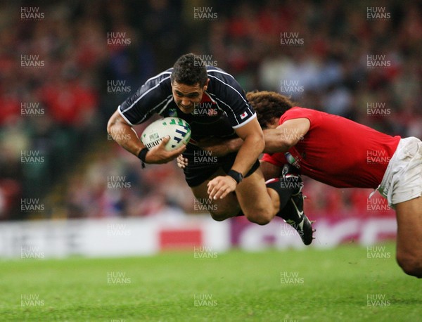 20.09.07 Wales v Japan RWC2007 Wales'  Colin Charvis tackles a flying  Bryce Robins 