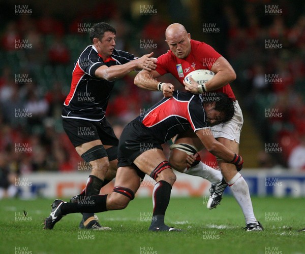 20.09.07 Wales v Japan RWC2007 Wales' Will James powers through Japan's Hitoshi Ono and Luke Thompson 