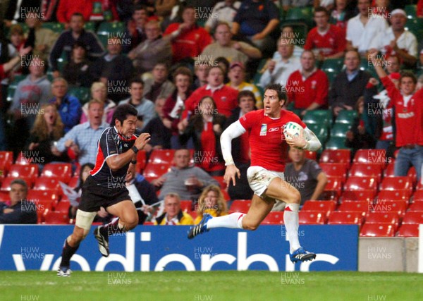 20.09.07 - Wales v Japan RWC 2007 Wales' James Hook beats Japan's Yuta Imamura to claim a try 