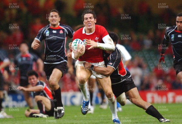 20.09.07 - Wales v Japan RWC 2007 Wales' James Hook is brought down 