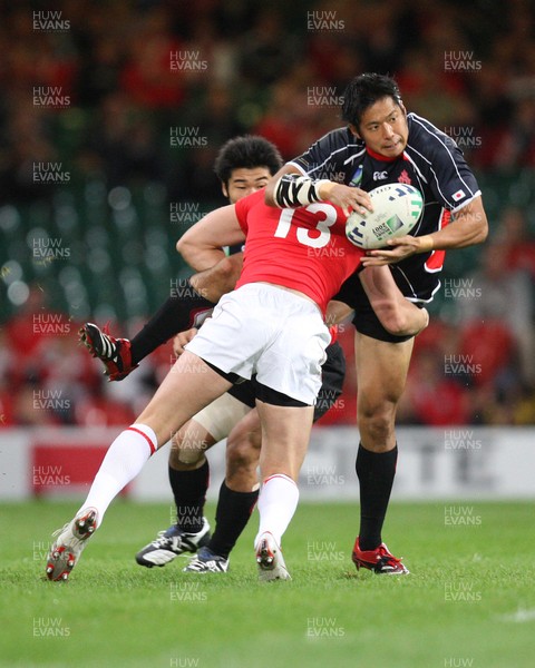 20.09.07 - Wales v Japan, RWC 2007 -   Japan's Kosuke Endo is tackled by Wales' Jamie Robinson 