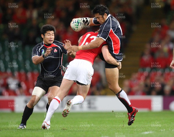 20.09.07 - Wales v Japan, RWC 2007 -   Japan's Kosuke Endo is tackled by Wales' Jamie Robinson 
