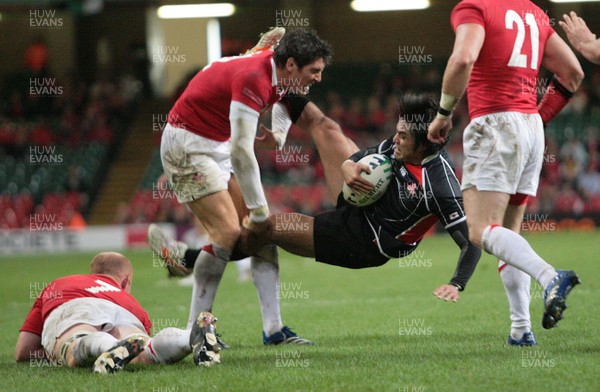 20.09.07 - Wales v Japan, RWC 2007 -  Wales' James Hook dumps Japan's Tatsuya Kusumi 