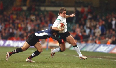 26.11.04  Wales v Japan, Cardiff  Wales Shane Williams is tackled by Koichiro Kubota  