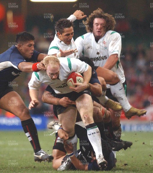 26.11.04  Wales v Japan, Cardiff Wales Tom Shanklin powers through as Naoya Okubo tackles 