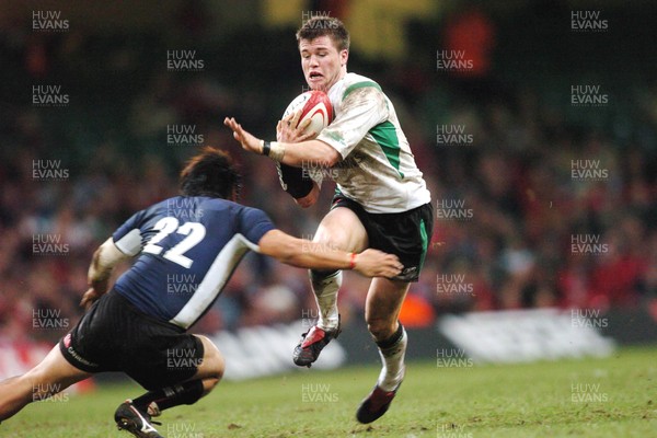 26-11-04. Wales v Japan  Wales' Ceri Sweeney gets past Tatushiko Otao.  