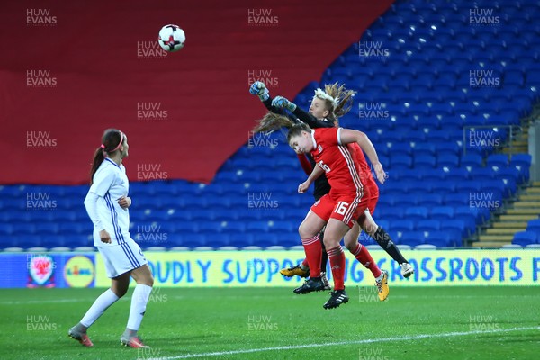 241117 Wales v Kazakhstan - FIFA Women's World Cup Qualifier -   Oksana Zheleznyak of Kazakhstan beats Alice Griffiths of Wales to a high ball
