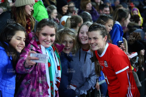 241117 Wales v Kazakhstan - FIFA Women's World Cup Qualifier -   Hayley Ladd of Wales celebrates  with young fans at the end of the game
