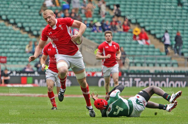 110513 - Wales v Kenya - IRB Sevens England - Craig Price of Wales evades a tackle before scoring a try 