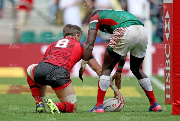 200617  - Wales vs Kenya - HSBC World Rugby Sevens Series - Lloyd Evans of Wales has the ball knocked out of his hands as he is about to score a try  