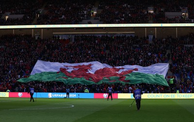 280323 - Wales v Latvia - European Championship Qualifier - Group D - Wales flag during the anthem