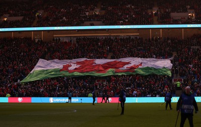 280323 - Wales v Latvia - European Championship Qualifier - Group D - Wales flag during the anthem