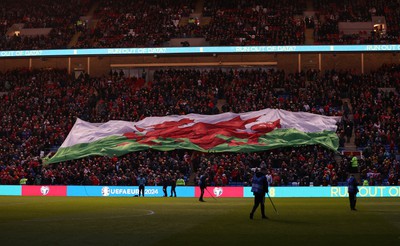 280323 - Wales v Latvia - European Championship Qualifier - Group D - Wales flag during the anthem