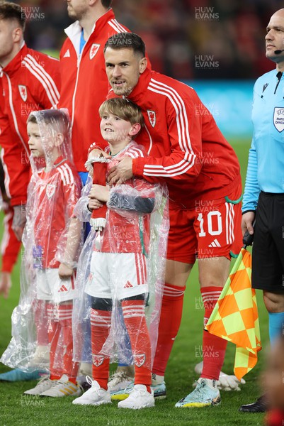 280323 - Wales v Latvia - European Championship Qualifier - Group D - Aaron Ramsey of Wales with his son