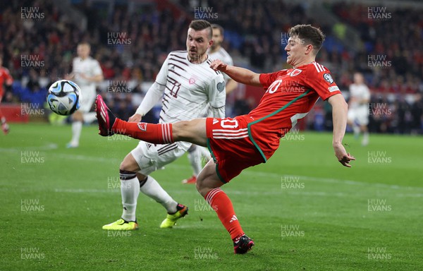 280323 - Wales v Latvia - European Championship Qualifier - Group D - Daniel James of Wales is challenged by Roberts Savalnieks of Latvia 