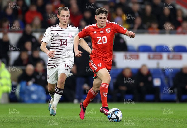280323 - Wales v Latvia - European Championship Qualifier - Group D - Daniel James of Wales is challenged by Andrejs Ciganiks of Latvia