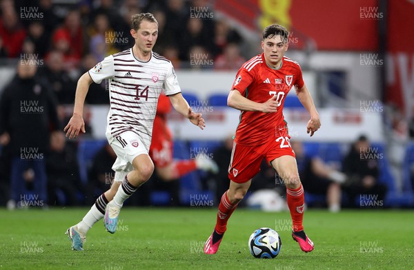 280323 - Wales v Latvia - European Championship Qualifier - Group D - Daniel James of Wales is challenged by Andrejs Ciganiks of Latvia