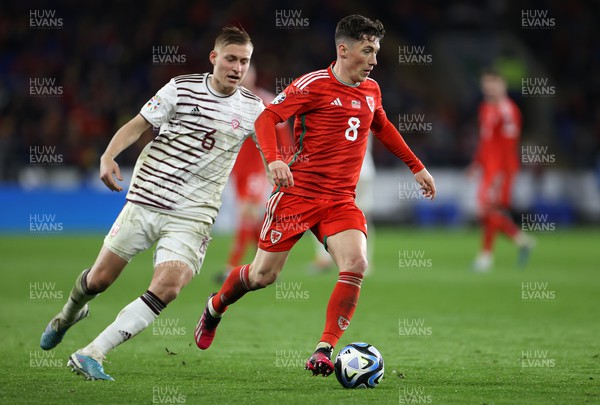 280323 - Wales v Latvia - European Championship Qualifier - Group D - Harry Wilson of Wales is challenged by Kristers Tobers of Latvia 