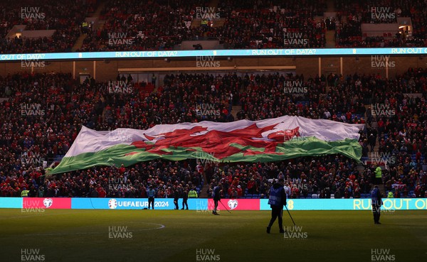 280323 - Wales v Latvia - European Championship Qualifier - Group D - Wales flag during the anthem