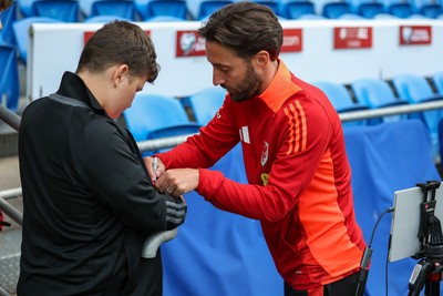 060625 - Wales v Liechtenstein - 2026 FIFA World Cup Qualifying - Josh Sheean of Wales with fan