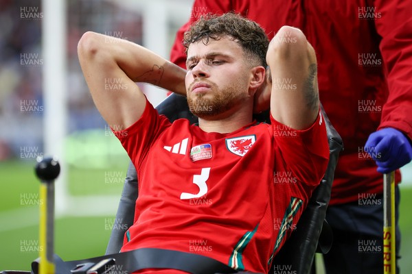 060625 - Wales v Liechtenstein - 2026 FIFA World Cup Qualifying - Neco Williams of Wales leaves field injured