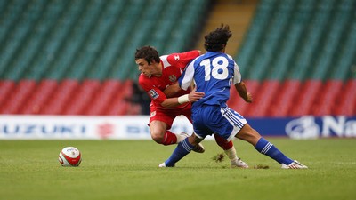 11.10.08 ... Wales v Liechtenstein, World Cup Qualifying Match Group 4, Millennium Stadium, Cardiff - Wales' Gareth Bale  takes on Liechtenstein's Michele Polverino  