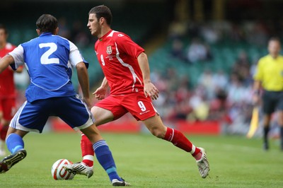 11.10.08 ... Wales v Liechtenstein, World Cup Qualifying Match Group 4, Millennium Stadium, Cardiff - Wales' Jason Koumas takes on Liechtenstein's Marco Ritzberger  