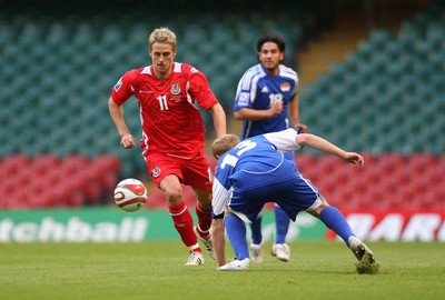 11.10.08 ... Wales v Liechtenstein, World Cup Qualifying Match Group 4, Millennium Stadium, Cardiff - Wales' David Edwards takes on Liechtenstein's Martin Buchel  