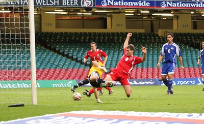 11.10.08 ... Wales v Liechtenstein, World Cup Qualifying Match Group 4, Millennium Stadium, Cardiff - Wales' Sam Vokes challenges Liechtenstein's keeper Peter Jehle    